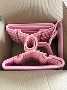 Set of Pink Plastic Clothes Hangers